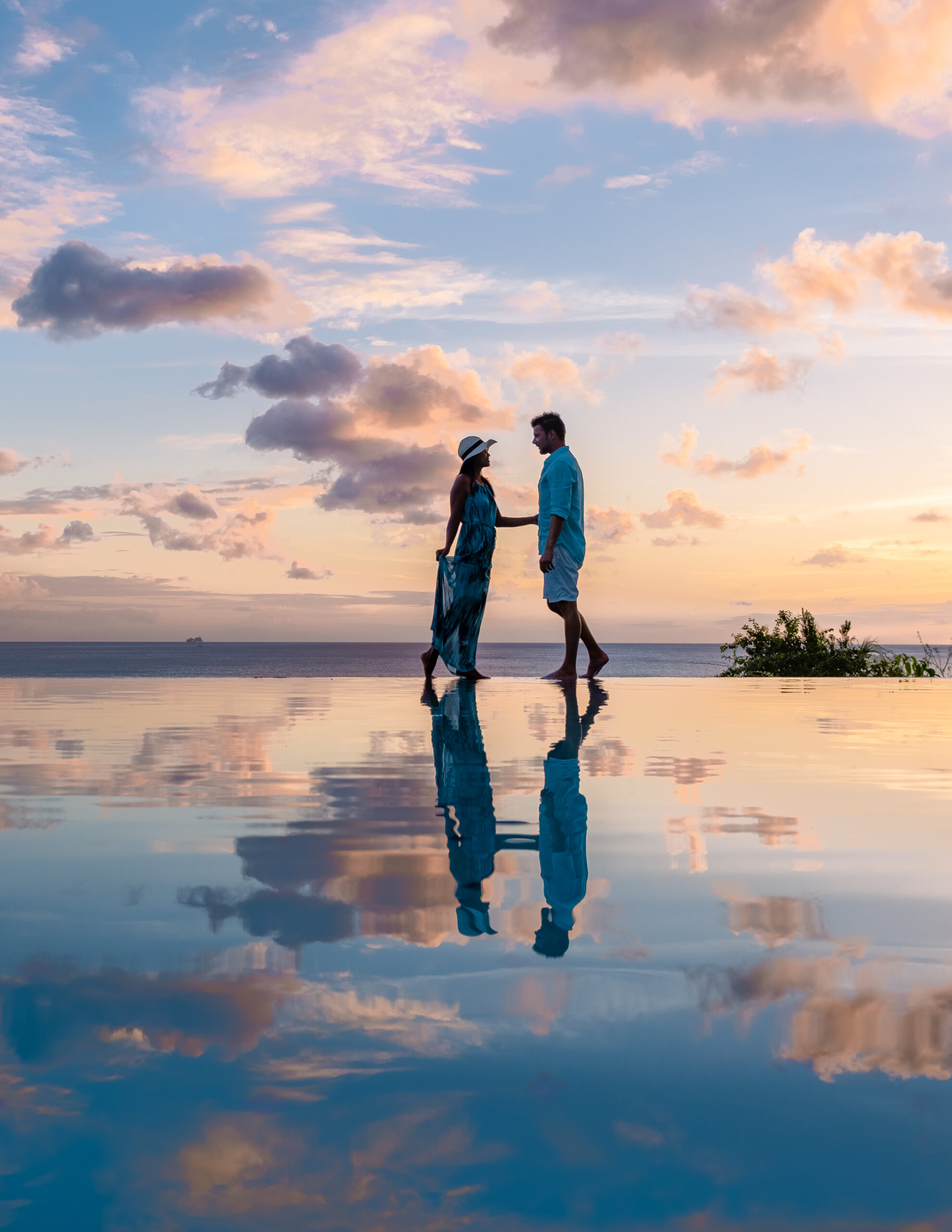 Heaven on Earth couple looking into each other's eyes on the beach